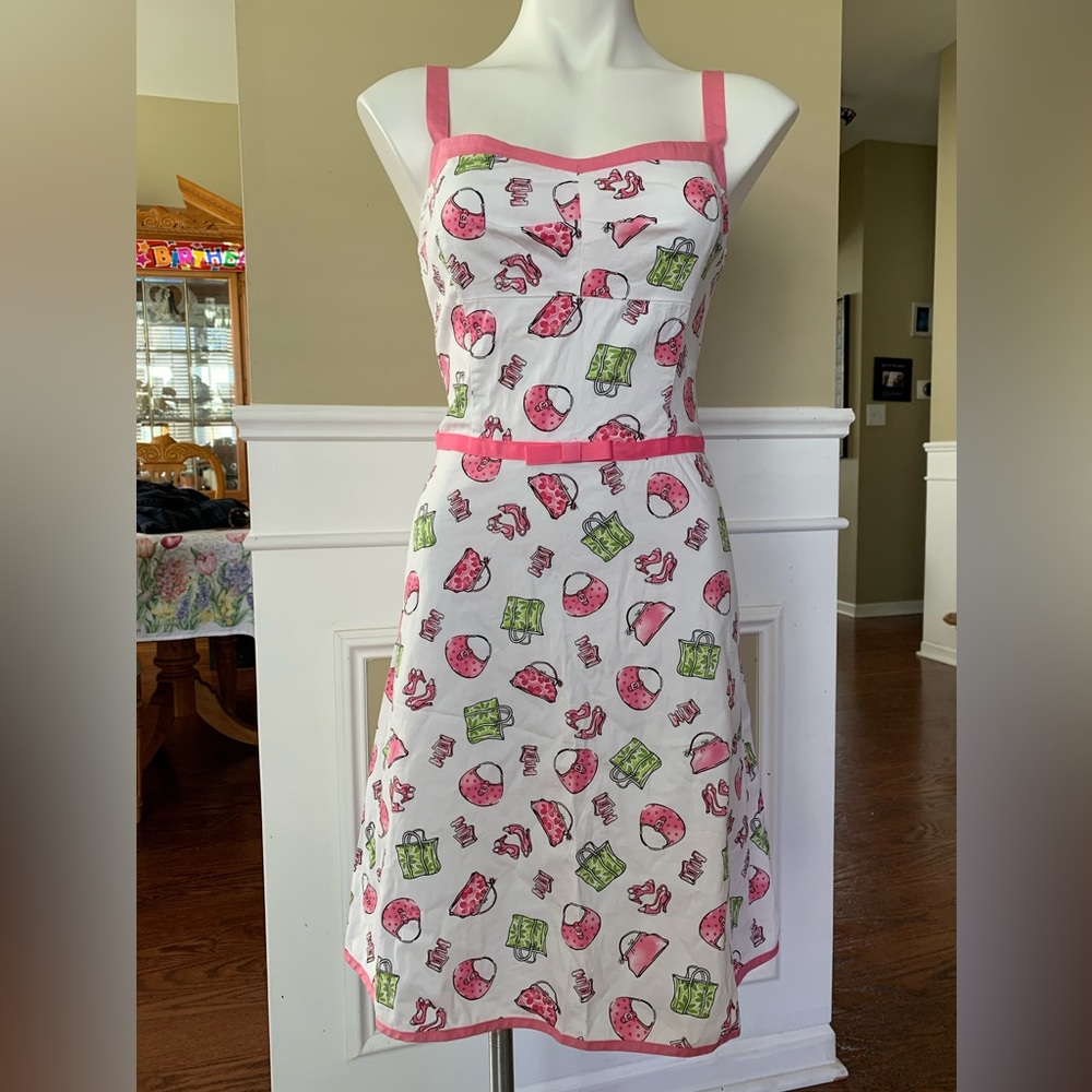 NWOT. A- Line dress great for shopaholics of purses and shoes